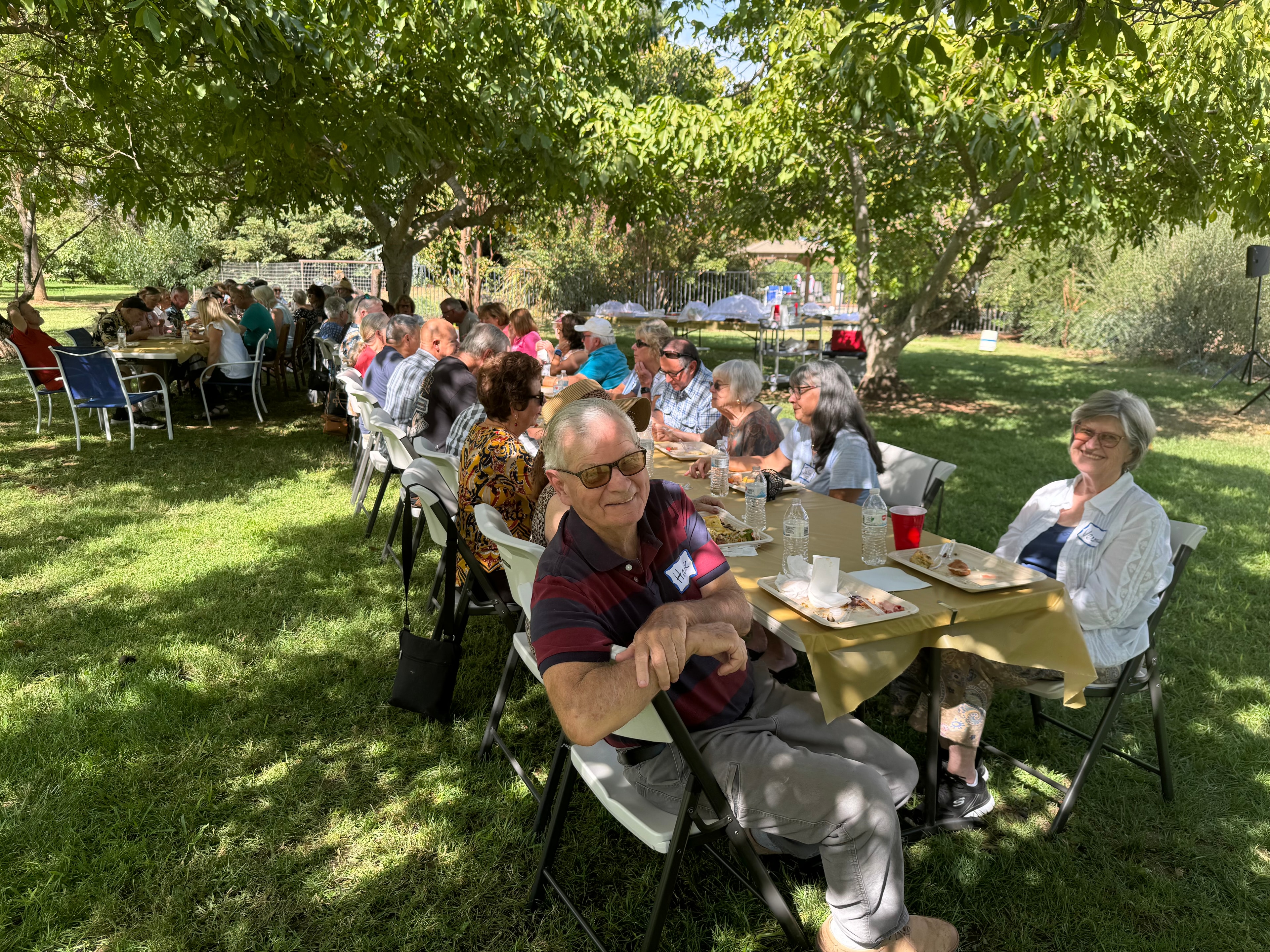 Church community sharing a meal outside